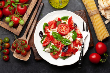 Caprese salad with fresh tomatoes, garden basil and mozzarella cheese