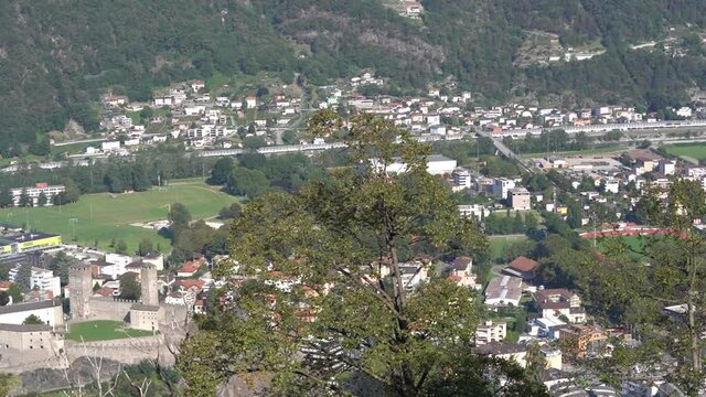 City of Bellinzona with UNESCO heritage castle Montebello on a sunny late summer morning. Movie Shot September 12th, 2021, Bellinzona, Switzerland.