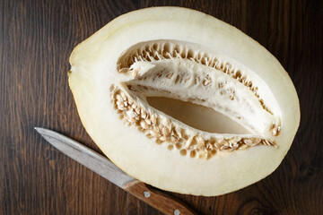 Melon, honey melon on wooden table background.