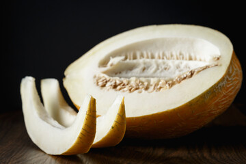 Melon, honey melon on wooden table background.