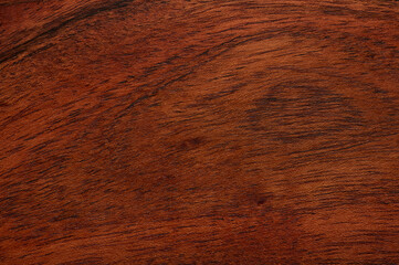 Abstract background of dark brown wooden surface. Closeup topview for artworks.