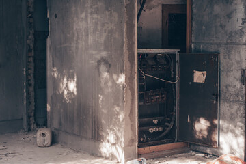 Old metal switchboard, in abandoned crumbling building