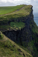 Fototapeta na wymiar Rocks at Cliffs of Moher. Ireland. South West Coast. Ocean. Burren region in County Clare. Steep hill.