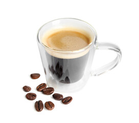 Cup of tasty espresso and scattered coffee beans on white background