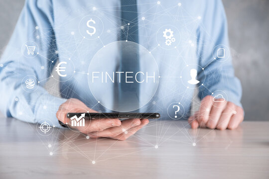 Businessman hold Fintech -financial technology concept.Business investment banking payment. Cryptocurrency investment and digital money. Business concept on virtual screen.