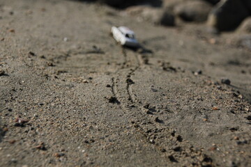 Toy car on the sand. Vintage car.Nature