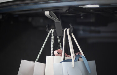 A hook for packages in the trunk of the car. Close up