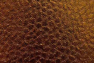 bumpy texture gold colored glass