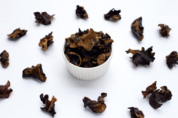 Dried black fungus on white background.