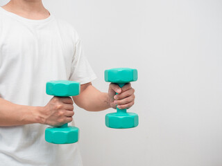 Man holding dumbbell green clolor white background crop shot copy space