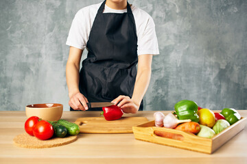 Woman in black apron Cooking healthy eating salad diet