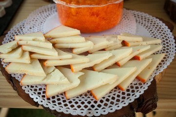 Half-cured smoked paprika cheese slices arrangement