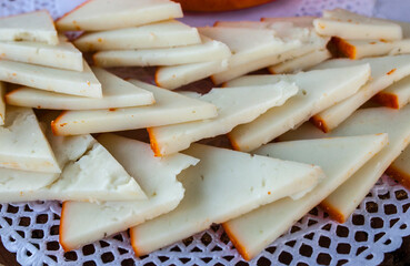 Half-cured smoked paprika cheese slices arrangement