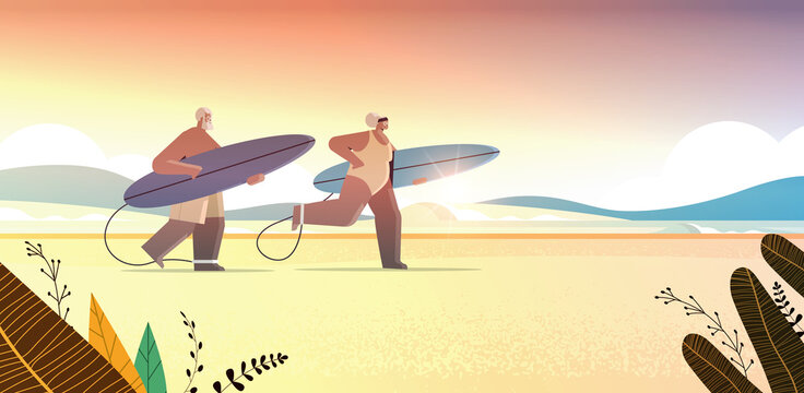 senior couple with surf boards aged man woman surfers holding surfboards summer vacation active old age