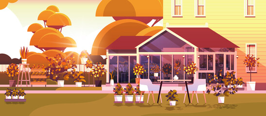 Obraz na płótnie Canvas backyard planting greenhouse glass orangery botanical garden with flowers and potted plants