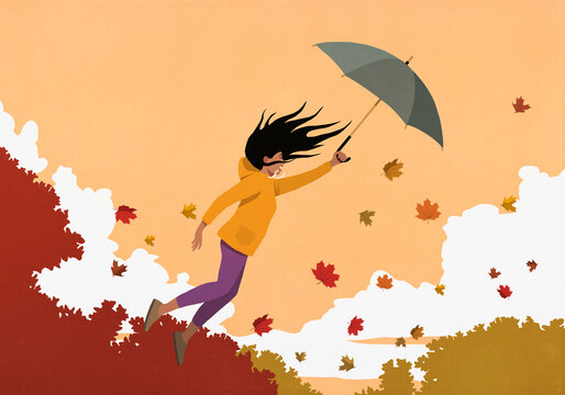 Woman with umbrella flying in autumn wind

