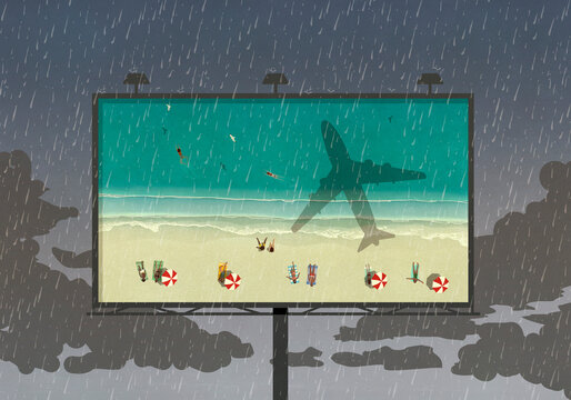 Tourists at beach on billboard against rainy sky
