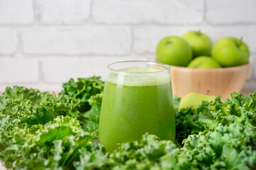 Green detox smoothie or blended juice in glass . Smoothie with kale, green apple and lime Green smoothie with kale, apple and lime