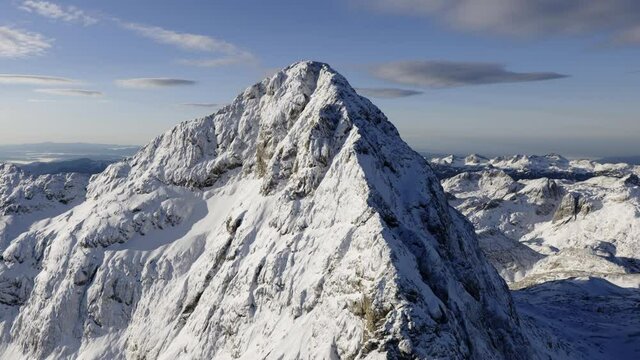 Aerial shot of mountain Triglav with snow on top
