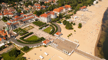 Sopot,Poland,Europe.Aerial photo from drone to the beach Sopot, wooden pier (molo) resort old lighthouse,  with marina, yachts, infrastructure, park, promenade and Sofitel Grand Sopot Hotel