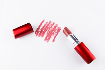 Open lipstick painting mark on white surface