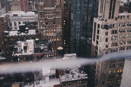 Fototapeta View of New York during daylight, seen from a tall building's window