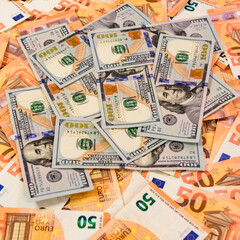 Many dollars and euros, texture of money, the advantage of the euro over the dollar.