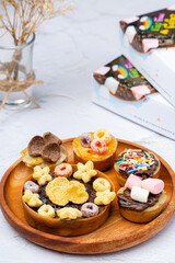 Martabak Mini or Martabak Mini Bangka with various Topping. The martabak mini bangka is made from a mixture of flour, eggs, sugar, baking soda, coconut milk and water.