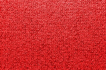 Factory fabric of red color . Close-up long and wide texture of natural red fabric. Fabric texture...