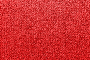 Factory fabric of red color . Close-up long and wide texture of natural red fabric. Fabric texture of natural cotton or linen textile material. Red canvas background