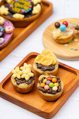 Martabak Mini or Martabak Mini Bangka with various Topping. The martabak mini bangka is made from a mixture of flour, eggs, sugar, baking soda, coconut milk and water.