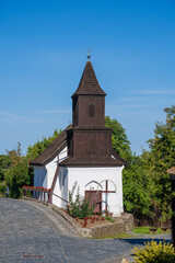Fototapeta na wymiar Old church of St. Martin on the street in ethnic village Holloko, Hungary