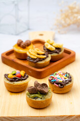 Martabak Mini or Martabak Mini Bangka with various Topping. The martabak mini bangka is made from a mixture of flour, eggs, sugar, baking soda, coconut milk and water.