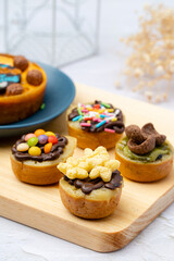 Martabak Mini or Martabak Mini Bangka with various Topping. The martabak mini bangka is made from a mixture of flour, eggs, sugar, baking soda, coconut milk and water.