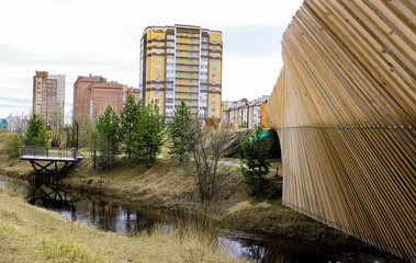 Houses on the river, fence and nature north of Russia