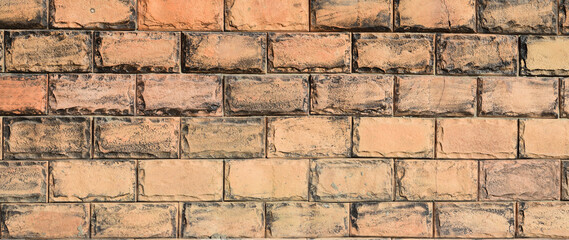 Surface texture of beige with brown concrete wall, cement pattern with cracks background with space to copy, panoramic view

