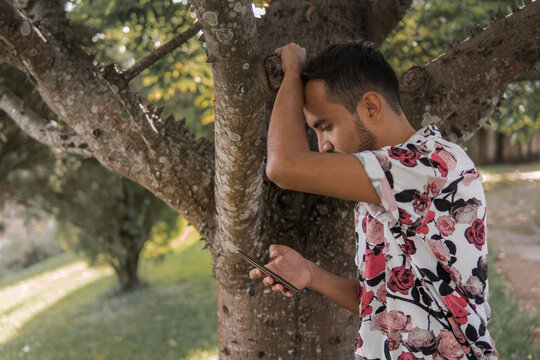 latin gay man reading homophobic comments about lbgti community 