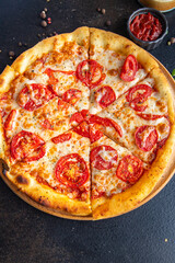 pizza margarita tomato, cheese, tomato sauce, dough Italian food fresh portion ready to eat meal snack on the table copy space food background rustic. top view