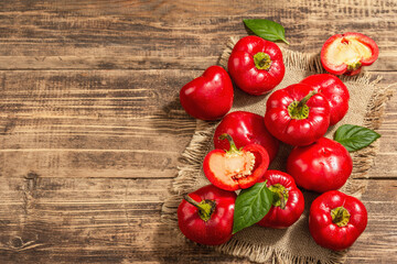 Ripe red round peppers on a vintage sackcloth napkin