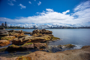 view of Sydney Harbour and CBD commercial and residential buildings, hotels and officer towers on the foreshore in NSW Australia