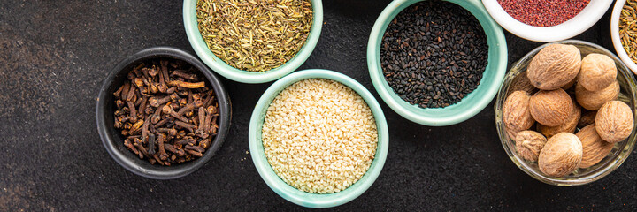 different types spices seasoning mix pungent and spicy herbs, ground spice fresh portion ready to eat meal snack on the table copy space food background rustic top view