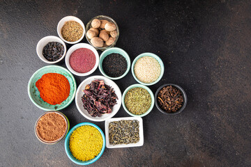different types spices seasoning mix pungent and spicy herbs, ground spice fresh portion ready to eat meal snack on the table copy space food background rustic top view