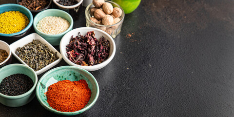 different types spices seasoning mix pungent and spicy herbs, ground spice fresh portion ready to eat meal snack on the table copy space food background rustic top view