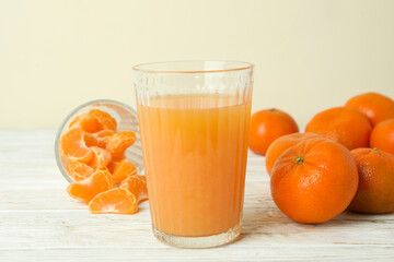 Mandarin jam and ingredients on white wooden table