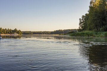 Summer landscape with a river. Early morning. Beautiful sunrise on the river.