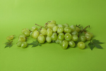 Green ripe grape on green background, close up