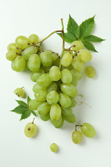 Green ripe grape with leaves on white background