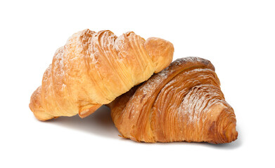 two baked croissants on a white isolated background, dessert for breakfast sprinkled with powdered sugar