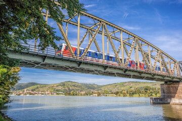 Train on bridge against Krems town in Wachau valley, Unesco world heritage site in Lower Austria, Austria