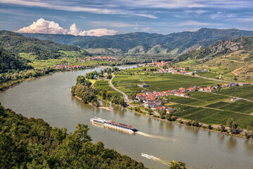 Panorama of Wachau valley (Unesco world heritage site) with ship on Danube river against Duernstein village in Lower Austria, Austria - obrazy, fototapety, plakaty